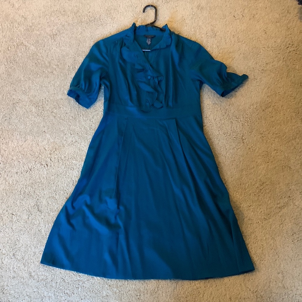 Teal silk dress. Excellent condition. Buttons at sleeves.